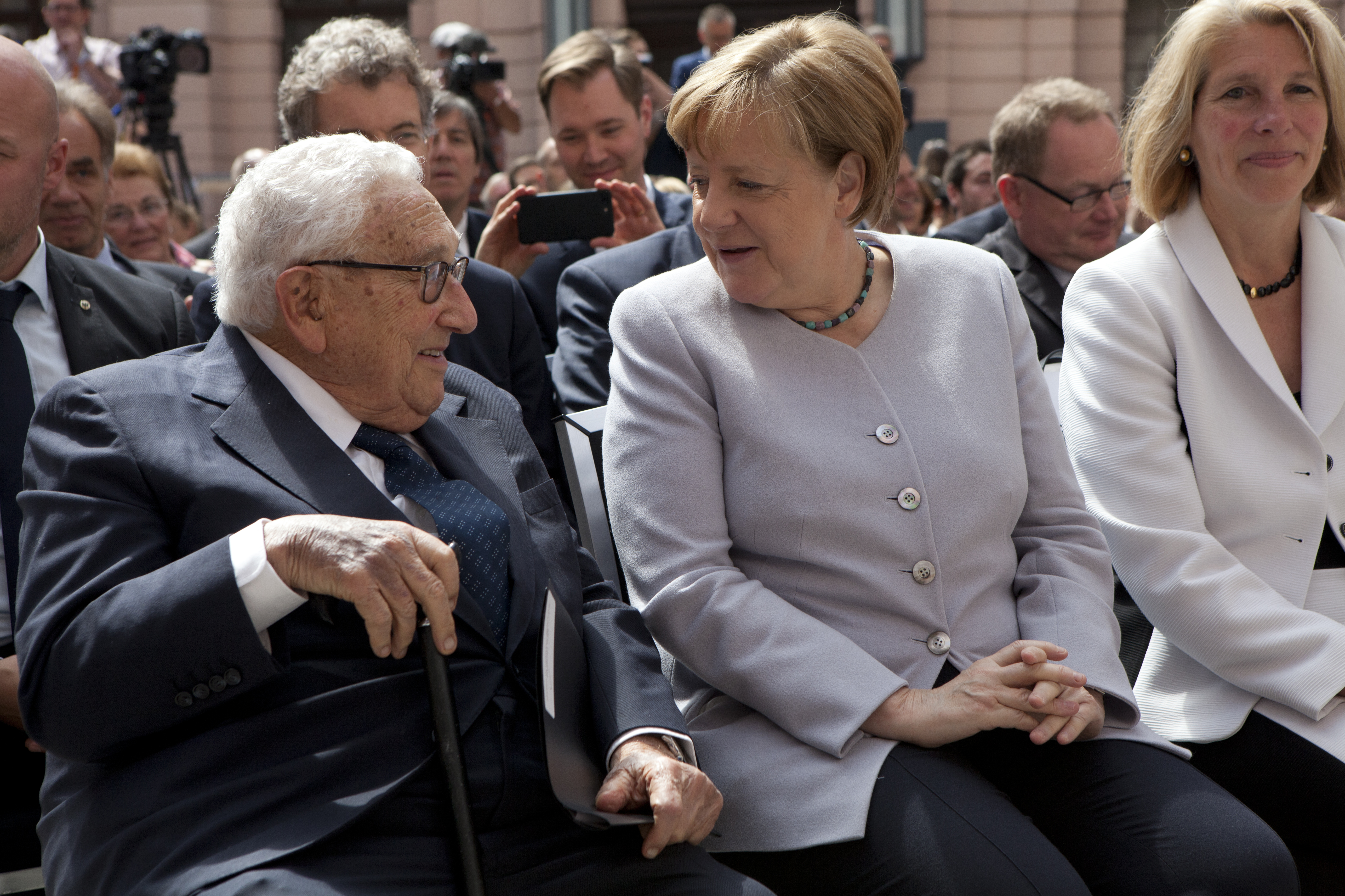 Chancellor Merkel greets Henry Kissinger