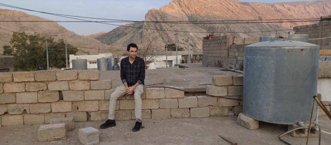 Figure 2 - Dilan Qadir on the rooftop of his childhood home in Darbandikhan, Kurdistan Region. March 12, 2023. Photo by Akbar Hassan. Copyright @Culturico